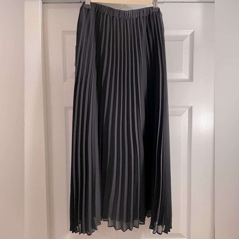 Black pleated midi skirt by CeCe. Size 14, brand new with tags, never been worn.